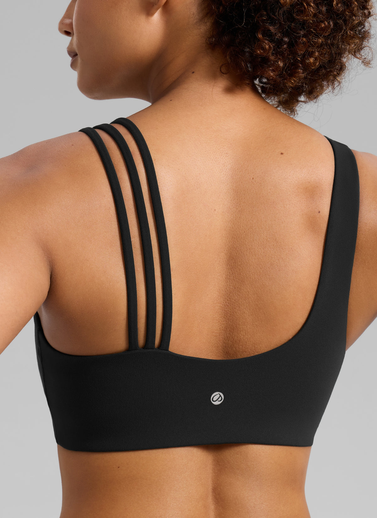 Sujetador deportivo de yoga Butterlift® para mujer con tirantes asimétricos, sujeción media, negro @model_info:Barbara
