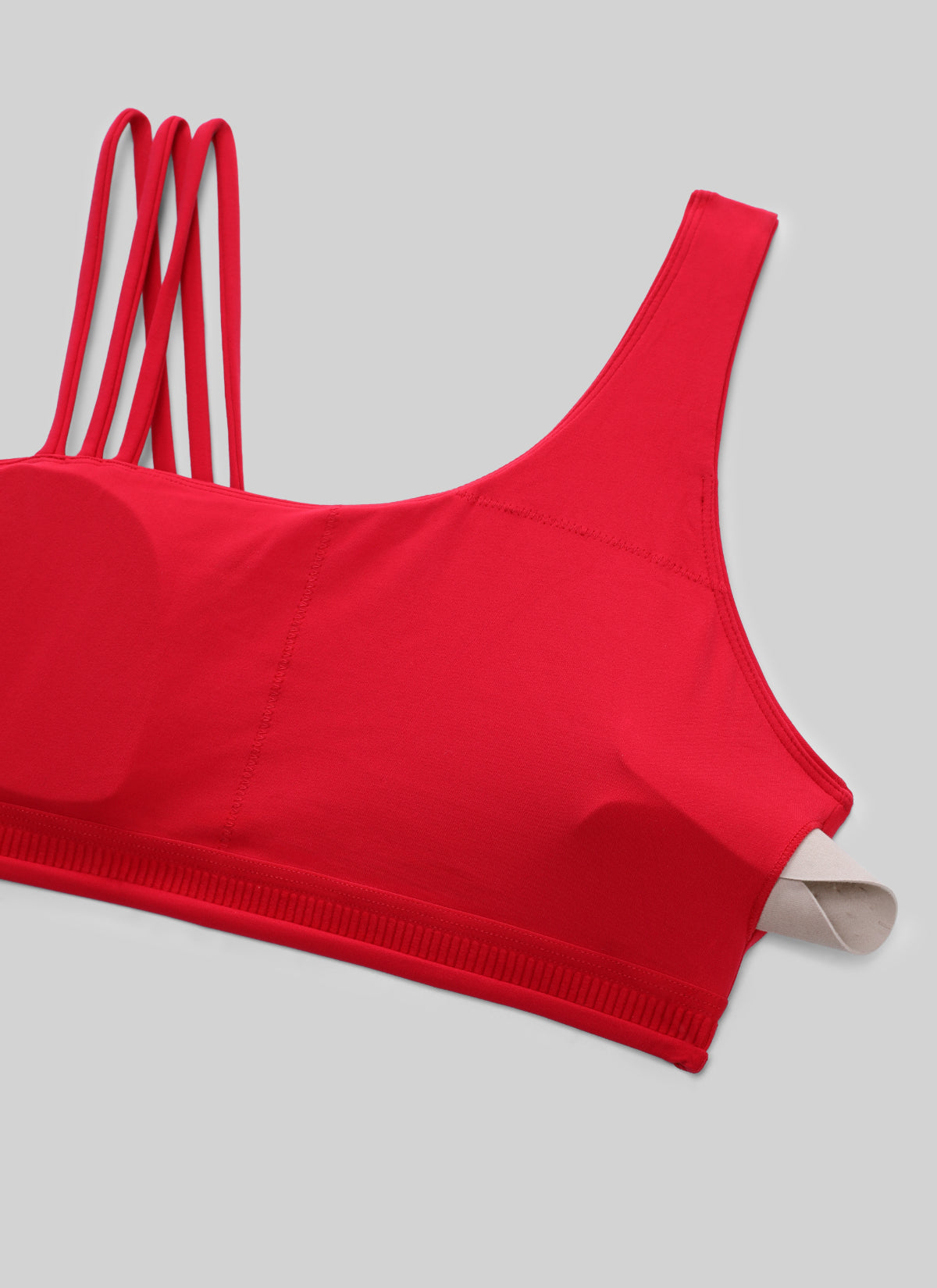 Női Butterlift® jóga sportmelltartó aszimmetrikus pántokkal, közepes tartással, Aurora Red színben