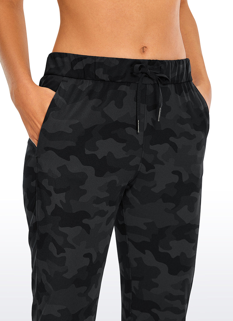 CRZ YOGA Women's Travel Slim Fit Stretch Drawstring 7/8 Pants 27'' Dark grey camouflage @model_info:Lo