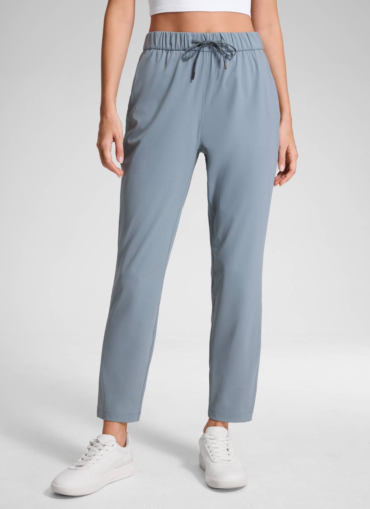 CRZ YOGA Women's Travel Slim Fit Stretch Drawstring 7/8 Pants 27'' Belgian Blue @model_info:Anna