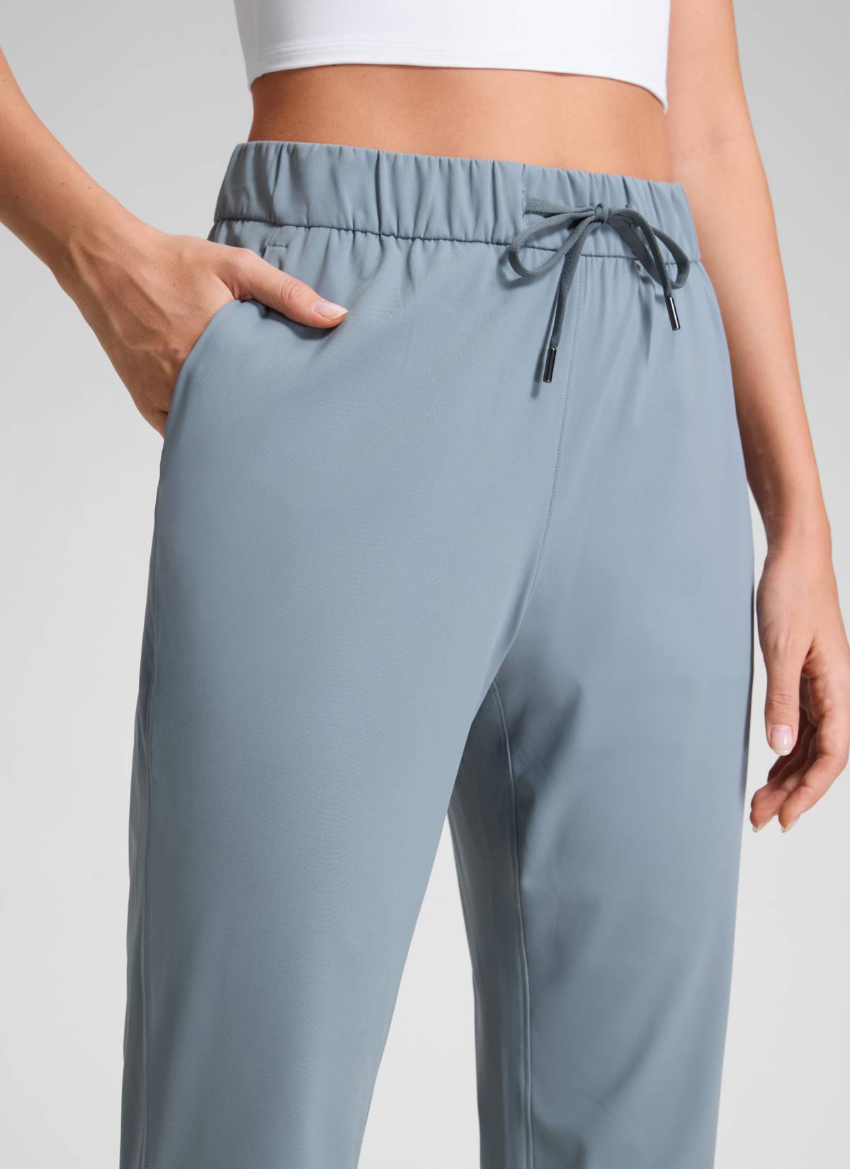 CRZ YOGA Women's Travel Slim Fit Stretch Drawstring 7/8 Pants 27'' Belgian Blue @model_info:Anna