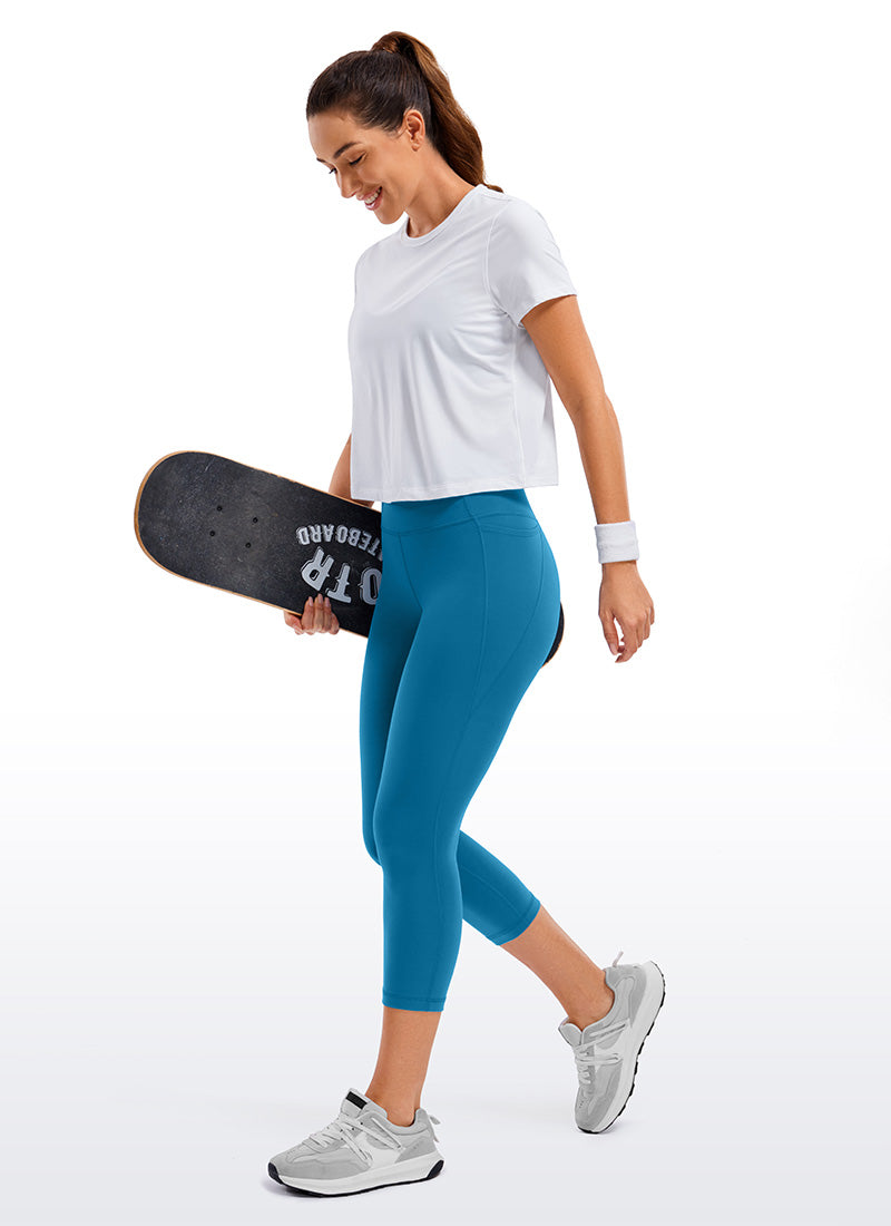 CRZ YOGA Dames Yoga Butterluxe Capri met hoge taille en zakken, 53 cm, Super-sonic blauw