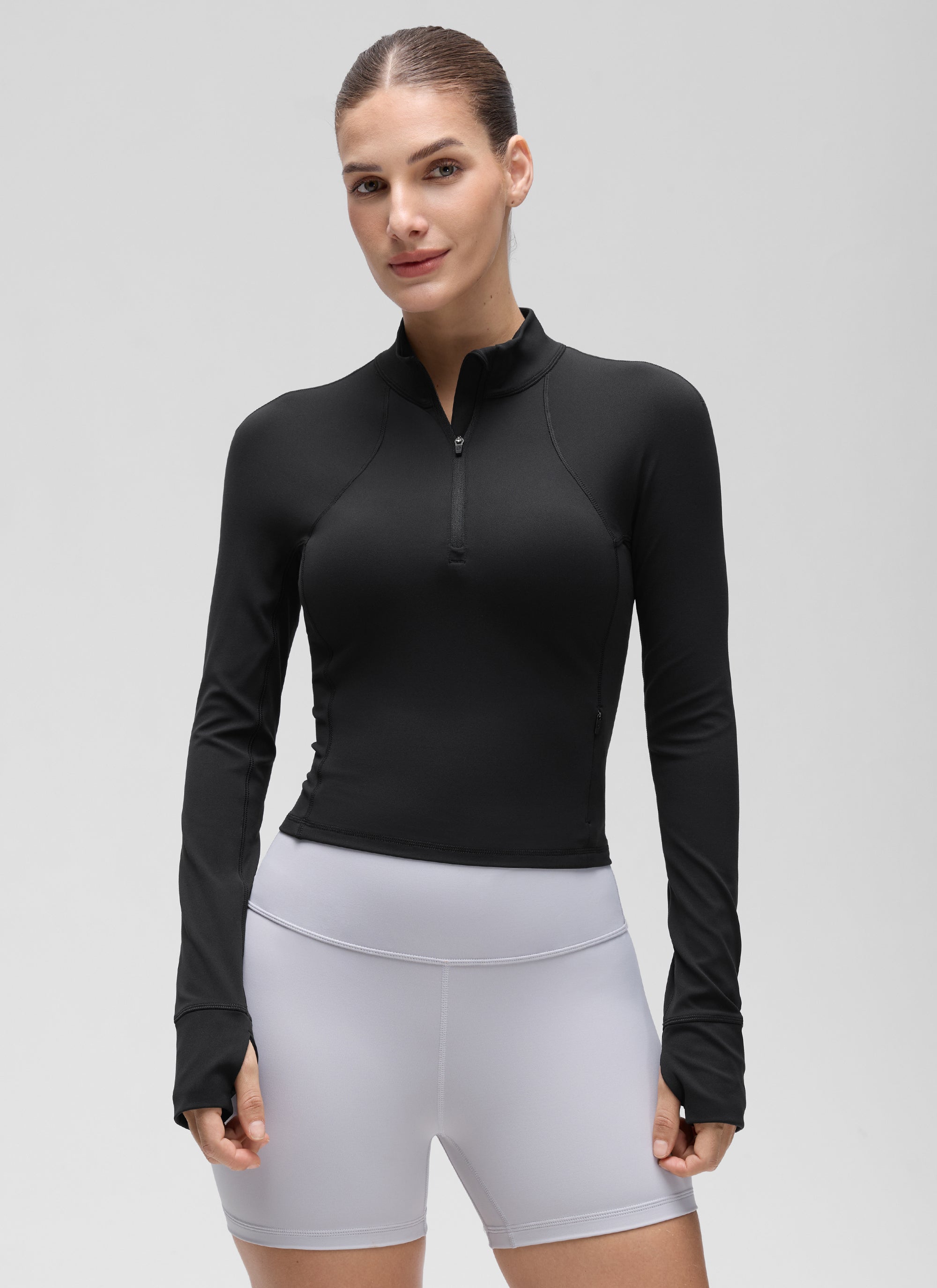 Camiseta de yoga de corte entallado Butterluxe con media cremallera y manga larga para mujer Negro @model_info:Jaynne