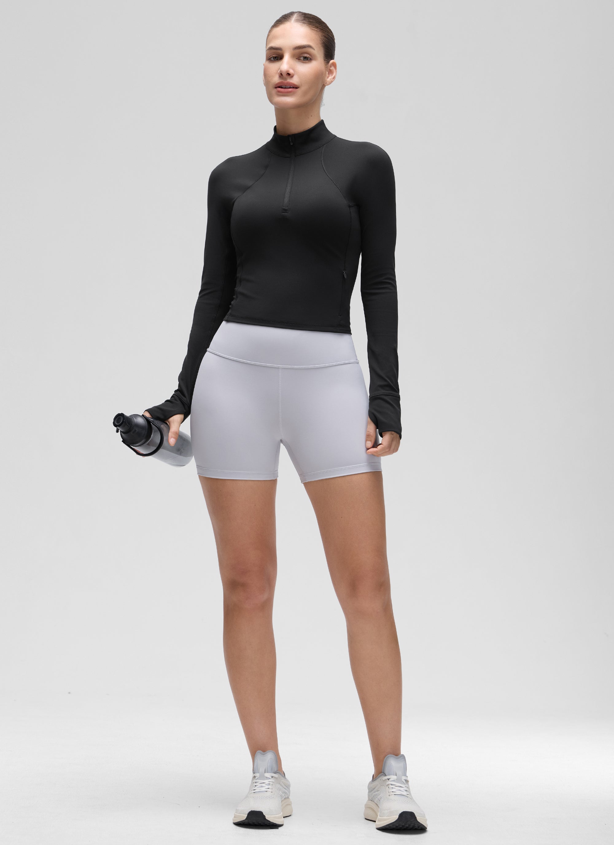 Camiseta de yoga de corte entallado Butterluxe con media cremallera y manga larga para mujer Negro @model_info:Jaynne