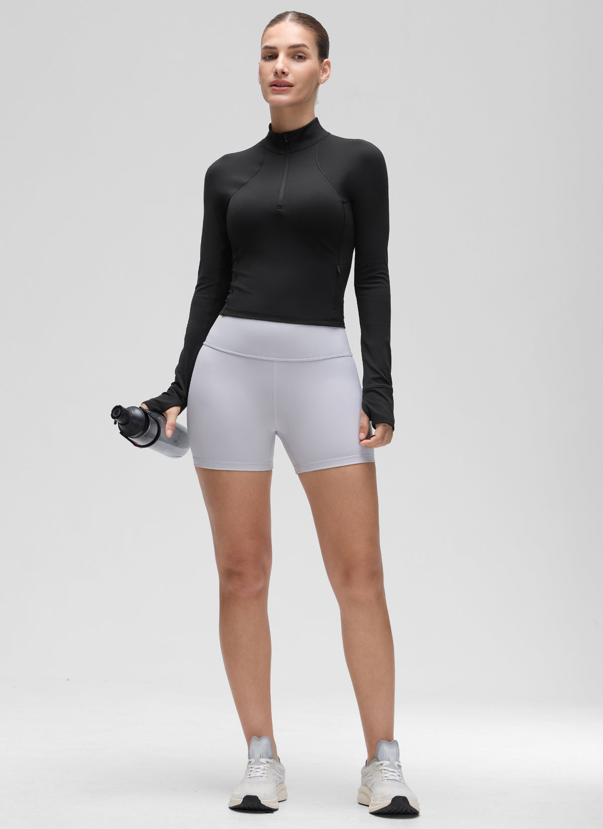 Camiseta de yoga de corte entallado Butterluxe con media cremallera y manga larga para mujer Negro @model_info:Jaynne